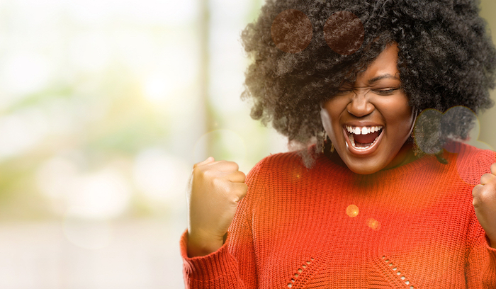 A photo of a woman happy about her fat freezing results.